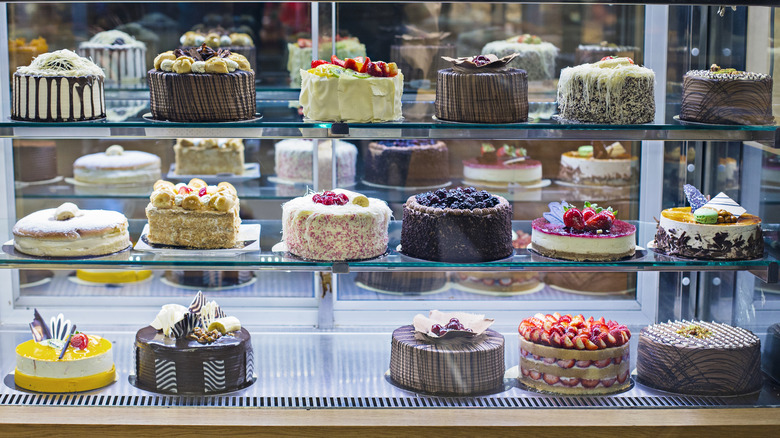 Various cakes on display in a shop