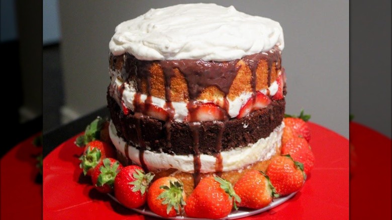 A homemade atomic cake ringed by strawberries
