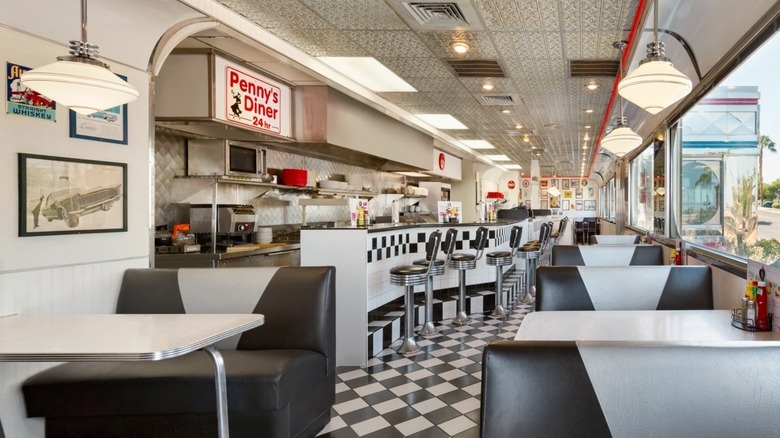 Penny's Diner interior with checkered floors and booths