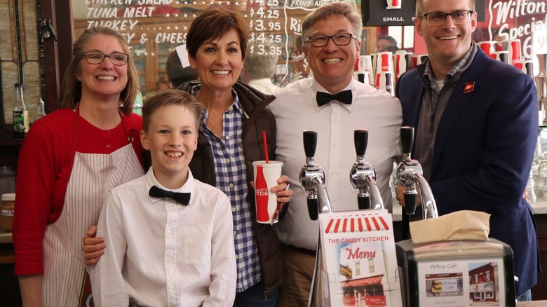 Family posing at Wilton Candy Kitchen in Iowa