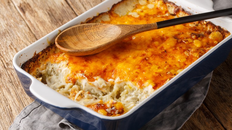 Delmonico potato casserole served with a spoon