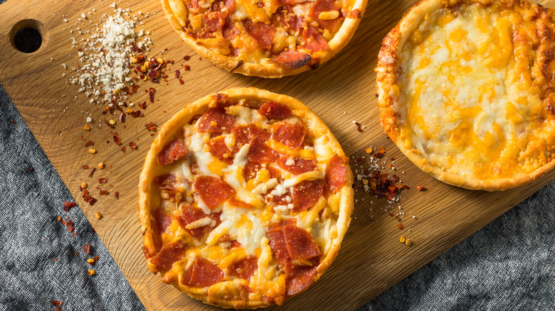 Various cooked frozen pizzas