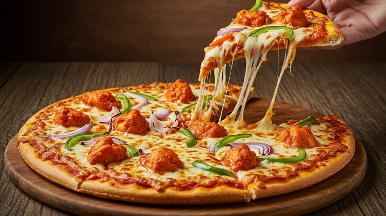 Pizza topped with crispy chicken and veggies