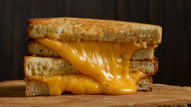 Two stacked halves of a grilled cheese