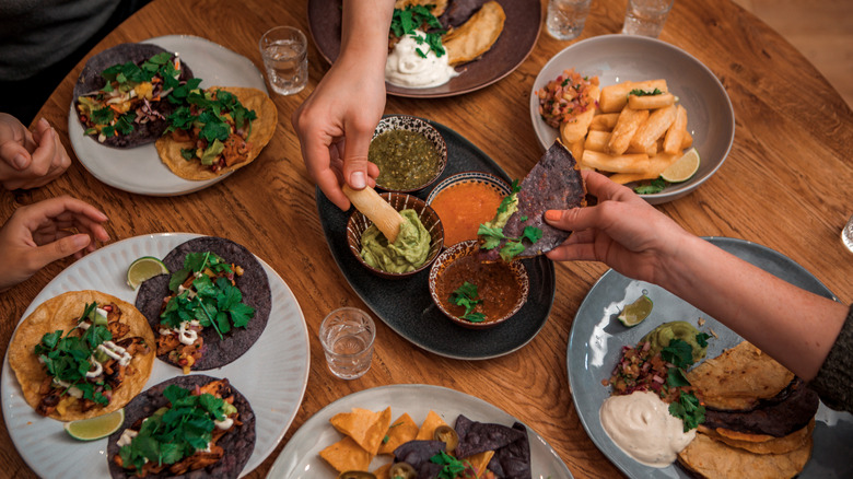 Sharing tacos in a restaurant
