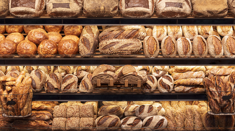 Various loaves of bread on display at a bakery