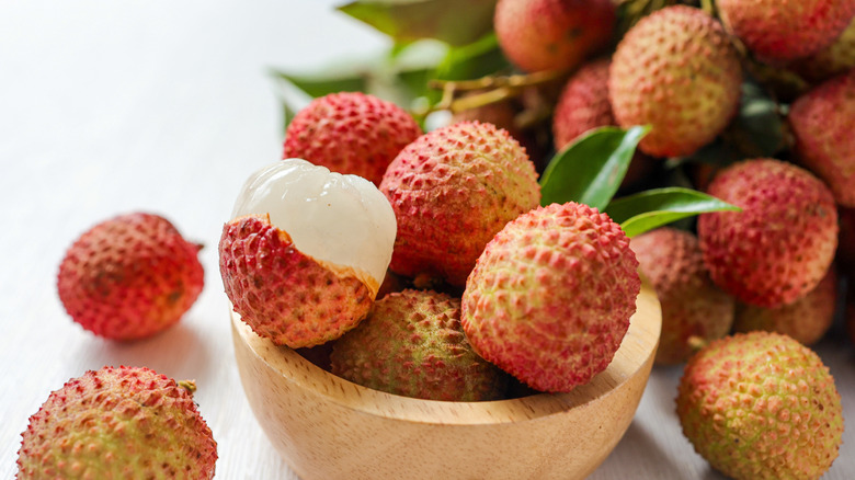 A bowl of fresh lychees.