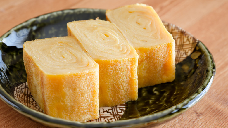 tamagoyaki, a sweetened Japanese omelet, rolled and sliced on a plate