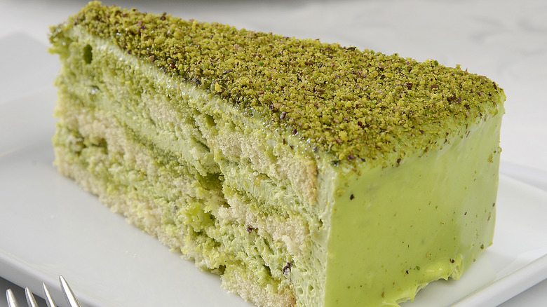 sliced green cake served on plate