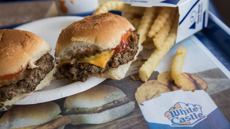 Two White Castle burgers and fries on a White Castle tray
