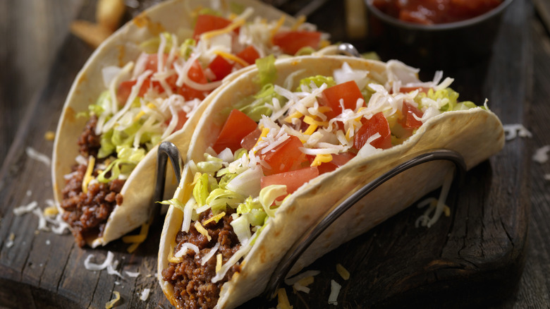 fast-food style tacos propped up in holders