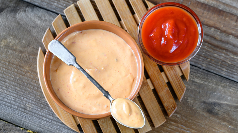 Bowls of Thousand Island dressing and ketchup