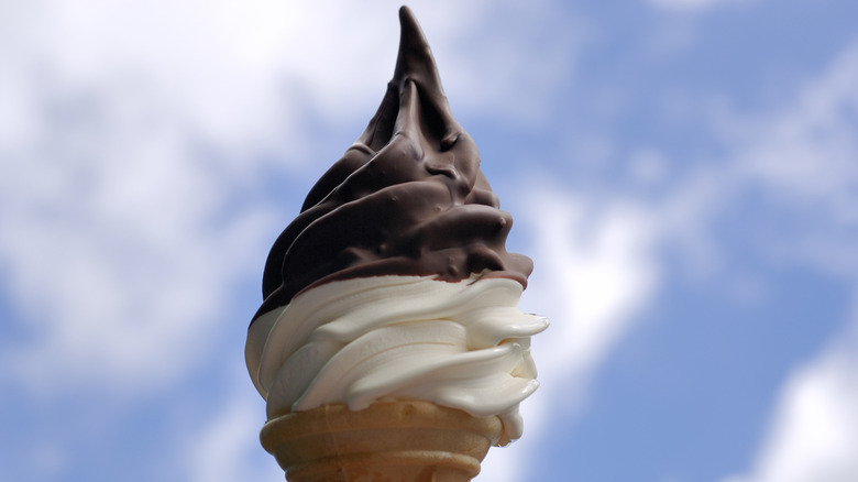 A chocolate-dipped soft-serve ice cream cone.