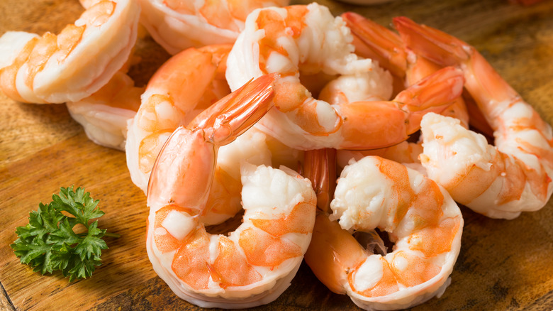 Cooked shrimp on a wooden platter