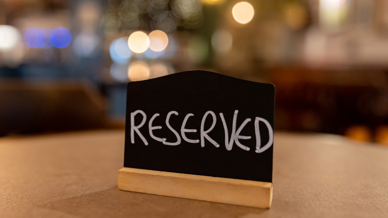 Reserved chalkboard sign on table
