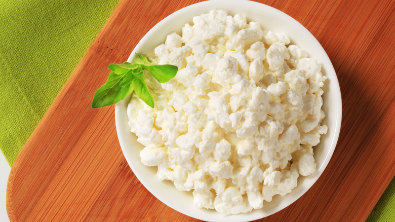 bowl of cottage cheese on wooden slab