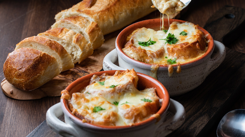 Classic French onion soup bowls with baguette