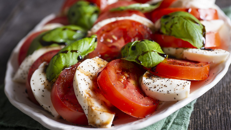 Caprese salad with tomatoes, mozzarella, and basil