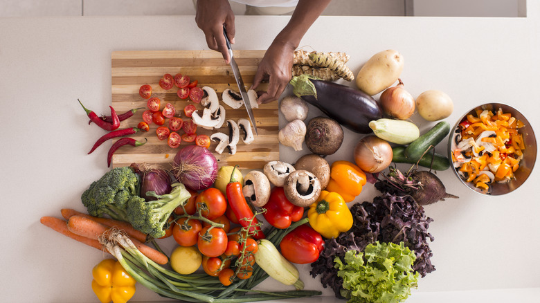 Slicing vegetables on cutting board
