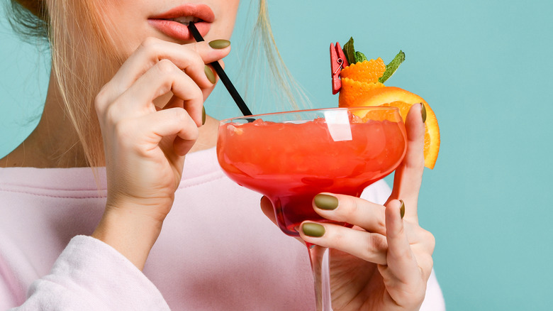 Cocktail with mini plastic straws