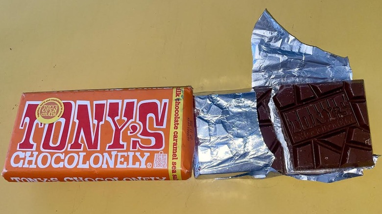 Overhead view of an unwrapped Tony Chocolonely Milk Chocolate Caramel Sea Salt Chocolate Bar