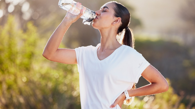 Woman drinking a bottle of water