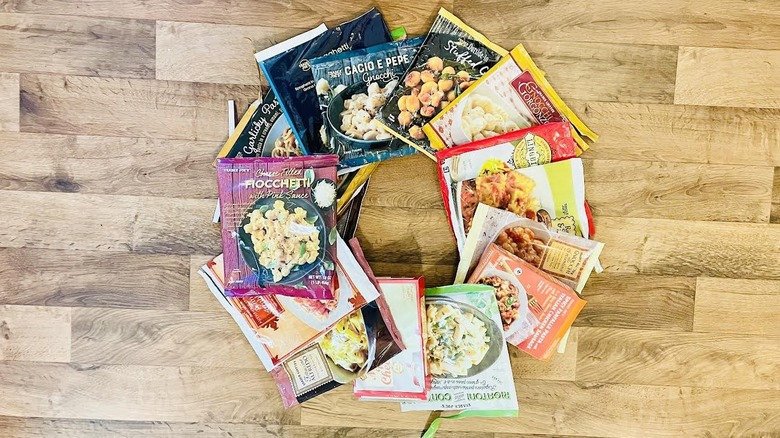 Collection of empty Trader Joe's frozen pasta bags and boxes