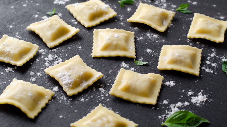 Fresh ravioli on metal slab