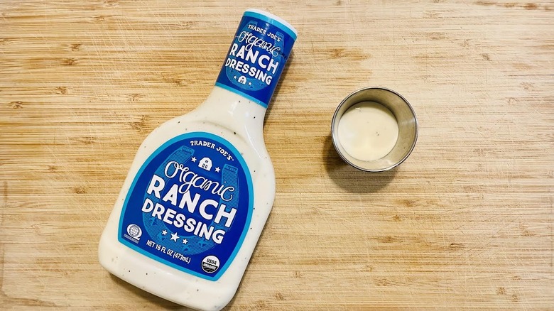 Bottle of Trader Joe's Organic Ranch Dressing with ramekin on side