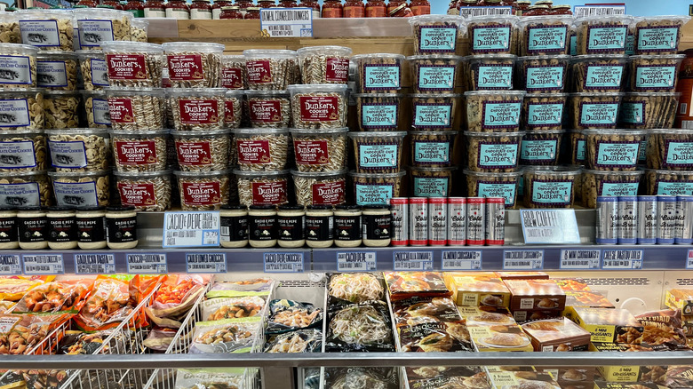 Trader Joe's frozen food case with snacks stacked above it