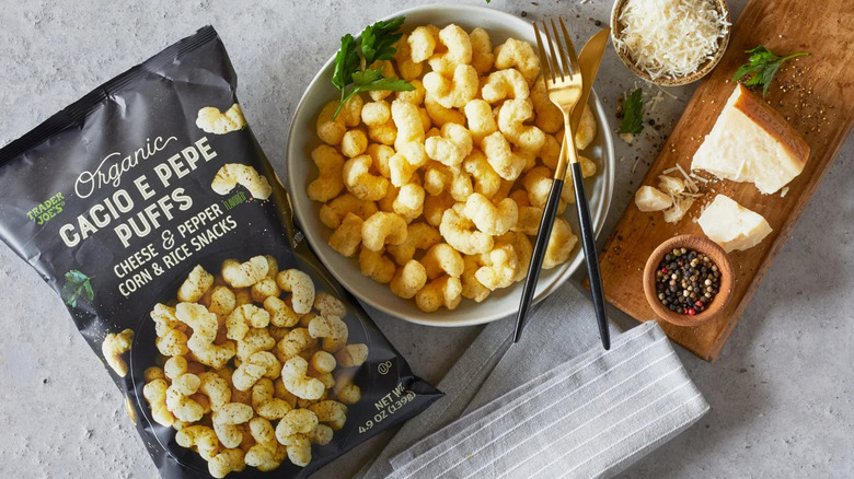 Trader Joe's Cacio e Pepe Puffs alongside cheese and peppercorns