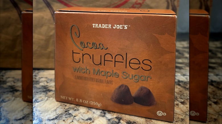 A box of Trader Joe's cocoa truffles sits on a countertop