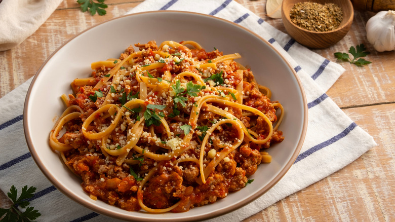 Bowl of pasta Bolognese with parmesan cheese