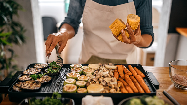 arranging roasted veggies on tray