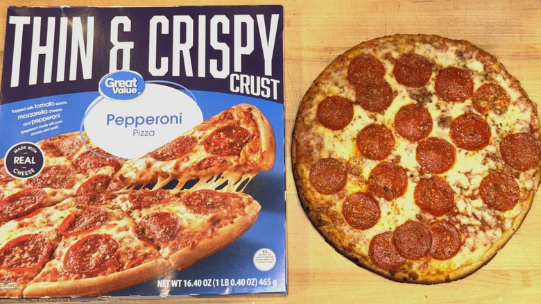 Great Value Thin & Crispy Pepperoni Pizza baked and placed on a wooden cutting board next to the box