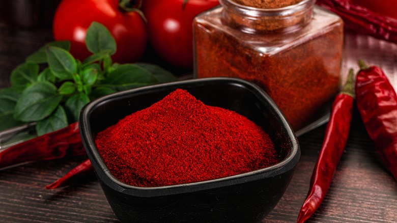Bowl and jar of paprika