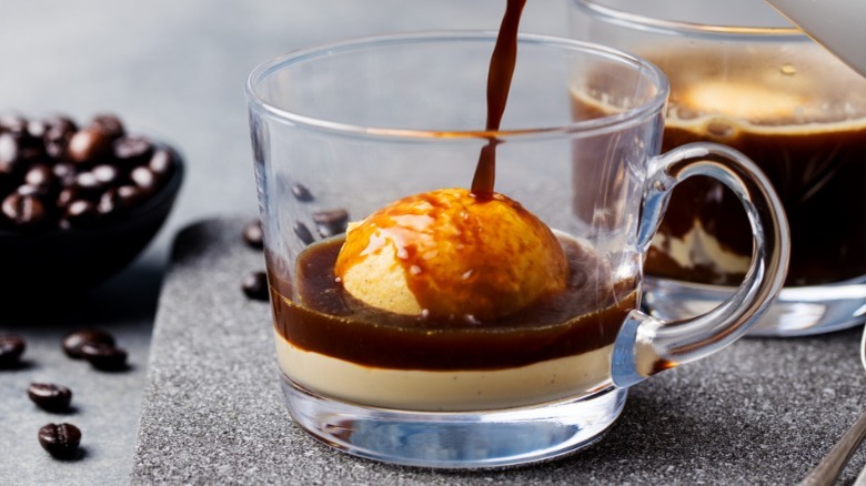 Coffee being poured over ice cream 