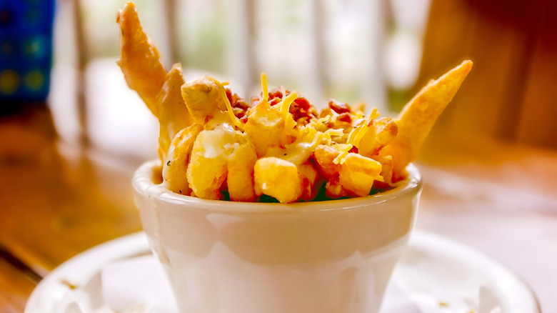 fries topped with clam chowder, cheese, and bacon