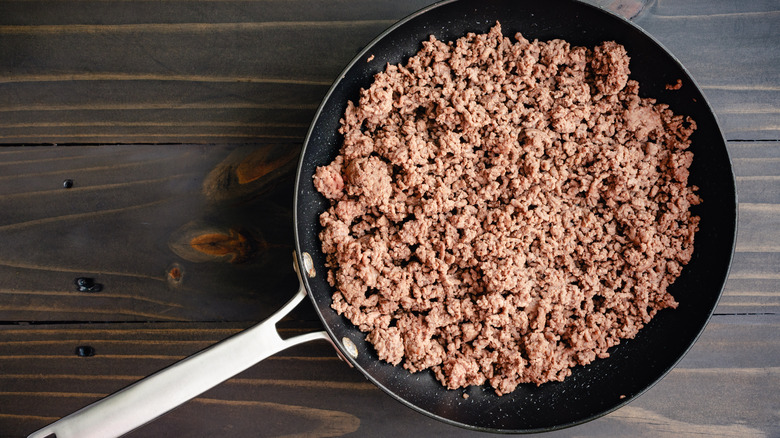 Skillet with cooked ground beef