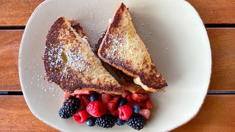 french toast with powdered sugar and berries