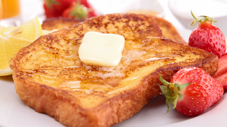 French toast with lemon wedge and berries