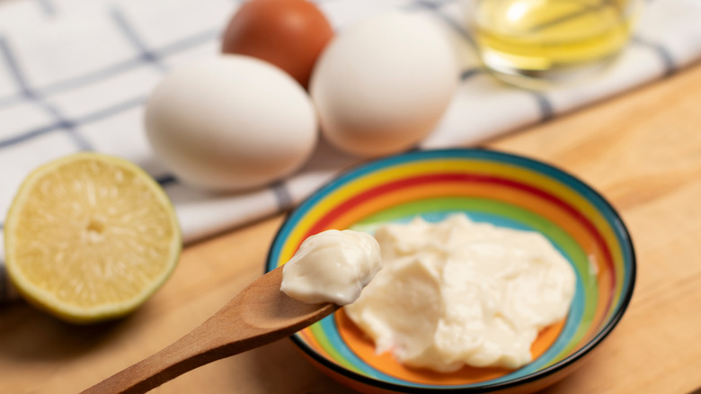 bowl of mayo with eggs and oil