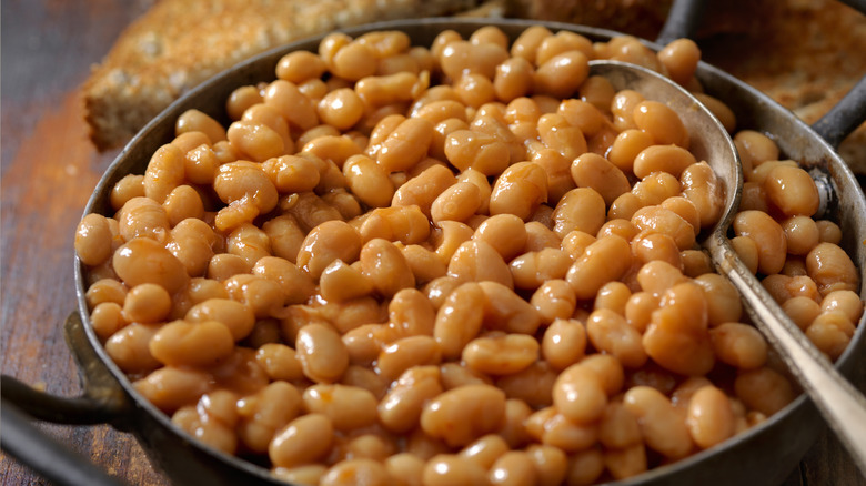 Bowl of baked beans with silver spoon