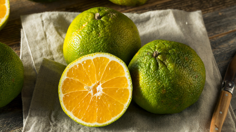 Ugli fruits sliced on a napkin