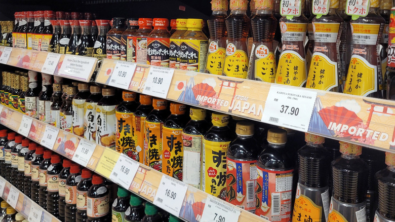 Rows of soy sauce and sesame oil in supermarket