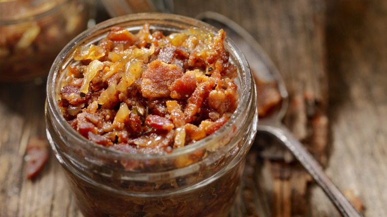 bacon jam in a jar next to spoon