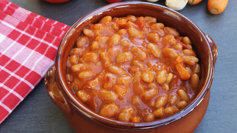 Baked beans in a ceramic crock.