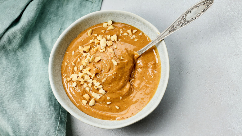 Peanut sauce topped with crushed peanuts.