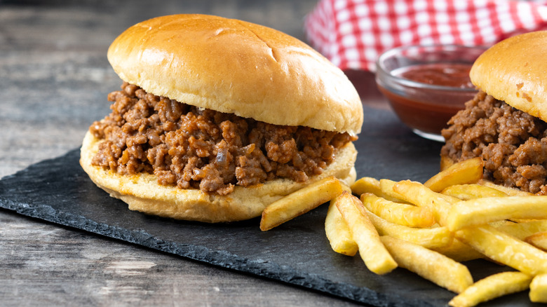 A sloppy Joe sandwiches with a side of fries