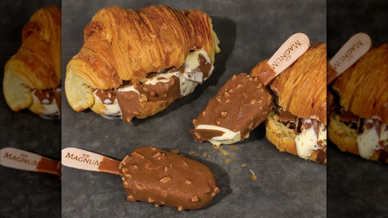 Two Magnum croissants, decadently dripping with chocolate and ice cream, with two small Magnums leaning against them.